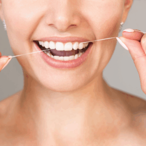 woman flossing her teeth
